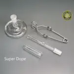 The Rogue Wax Works 14mm Quartz Cap showing the cap, bowl, tongs, and super dope stand